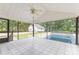 Inviting screened porch features tiled floors and views of the pool and fenced backyard at 115 Turner St, Lincolnton, NC 28092