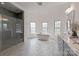 Luxurious bathroom featuring a soaking tub, walk-in shower, and double vanities at 11841 Churchfield Ln, Charlotte, NC 28277