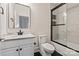 Bathroom featuring black and white tile, a marble vanity and a black framed shower at 11841 Churchfield Ln, Charlotte, NC 28277