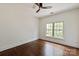 Bedroom with hardwood floors and a large window at 11841 Churchfield Ln, Charlotte, NC 28277
