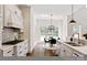 Open concept kitchen with an island and granite counters, with an adjacent breakfast nook at 11841 Churchfield Ln, Charlotte, NC 28277