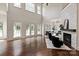 Bright living room showcases large windows, hardwood floors, and a cozy seating area at 11841 Churchfield Ln, Charlotte, NC 28277