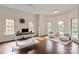 Bright office space with three large windows, hardwood floors and area rugs at 11841 Churchfield Ln, Charlotte, NC 28277