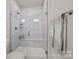 Modern bathroom featuring a glass-enclosed shower with white tile and a built in seat at 120 August Ln, Stallings, NC 28104