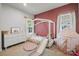 A playful bedroom featuring a unique open bed frame and soft pink details at 120 August Ln, Stallings, NC 28104