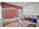 Playful bedroom with a pink accent wall and charming decor at 120 August Ln, Stallings, NC 28104
