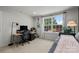 Cozy bedroom with lots of natural light, carpeted floors, and a dedicated desk area at 120 August Ln, Stallings, NC 28104