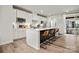 Modern kitchen featuring a white island, a stainless steel microwave, and an outdoor patio at 120 August Ln, Stallings, NC 28104