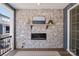 A welcoming outdoor space showcasing a stone fireplace and a view of the surrounding neighborhood at 120 August Ln, Stallings, NC 28104