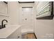 Bright bathroom featuring a sleek vanity, modern fixtures, and a shower with a glass door at 1214 Northwoods Dr, Kings Mountain, NC 28086