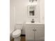 Well-lit bathroom featuring modern fixtures, a clean white vanity, and stylish tile flooring at 1214 Northwoods Dr, Kings Mountain, NC 28086