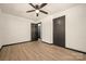 Bedroom with wood floors, ceiling fan, and an open door at 1214 Northwoods Dr, Kings Mountain, NC 28086