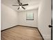 Neutral bedroom with hardwood floors, ceiling fan, and a single window for natural lighting at 1214 Northwoods Dr, Kings Mountain, NC 28086