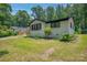 This single-story home is landscaped and located on a verdant lot at 1214 Northwoods Dr, Kings Mountain, NC 28086
