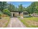 Charming single-story home with a well-manicured front yard and a convenient carport at 1214 Northwoods Dr, Kings Mountain, NC 28086