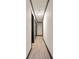 Hallway with dark trim, wood floor, and doors for extra storage at 1214 Northwoods Dr, Kings Mountain, NC 28086