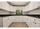 Updated kitchen featuring white cabinets and granite countertops at 1214 Northwoods Dr, Kings Mountain, NC 28086