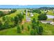 Aerial view of the home and surrounding area, showing mature trees and lush greenery at 124 Vintage Woods Ct, Shelby, NC 28150