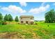 View of the home from the backyard with expansive green lawn at 124 Vintage Woods Ct, Shelby, NC 28150