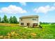 Full backyard view of home with a great green lawn at 124 Vintage Woods Ct, Shelby, NC 28150
