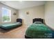 A bright bedroom features two twin beds with upholstered headboards and a sunlit window at 124 Vintage Woods Ct, Shelby, NC 28150