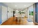 Dining area adjacent to kitchen with white table and chairs; bright with sliding door to outside at 124 Vintage Woods Ct, Shelby, NC 28150