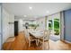 Bright dining room features a large white table and a sliding glass door to the outdoor area at 124 Vintage Woods Ct, Shelby, NC 28150
