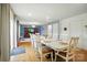 The dining area features an extra-long table next to the living room, blending living and dining at 124 Vintage Woods Ct, Shelby, NC 28150