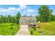 Charming two story home with green shutters and a well-manicured front yard at 124 Vintage Woods Ct, Shelby, NC 28150