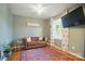 Cozy living room with wood floors, a brown sofa, and a stylish area rug at 124 Vintage Woods Ct, Shelby, NC 28150