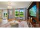 Comfortable living room with a TV, furniture, and large windows with backyard view at 124 Vintage Woods Ct, Shelby, NC 28150