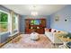 Well-lit living room showcasing a large TV, seating, and natural light at 124 Vintage Woods Ct, Shelby, NC 28150