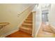 Carpeted staircase with white railing leading to the upper level of the home at 124 Vintage Woods Ct, Shelby, NC 28150