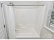 Bathroom featuring white shower and a shower curtain, with natural light from the windows at 14904 Rosemary Way Dr, Huntersville, NC 28078