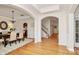 Formal dining room featuring hardwood floors, stylish chandelier, and elegant wainscoting at 14904 Rosemary Way Dr, Huntersville, NC 28078
