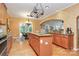Open kitchen with island, granite counters, and breakfast area at 14904 Rosemary Way Dr, Huntersville, NC 28078