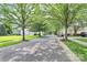 Scenic street view showcases mature trees lining the road at 14904 Rosemary Way Dr, Huntersville, NC 28078