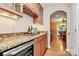 Convenient wet bar area featuring granite counters, wine fridge and custom cabinetry at 14904 Rosemary Way Dr, Huntersville, NC 28078