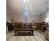Comfortable living area features a plush couch, decorative curtains, and wood wall paneling at 15 Rose St, York, SC 29745