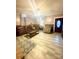 Inviting living room with ample seating, wood-look flooring, and abundant natural light at 15 Rose St, York, SC 29745