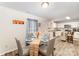 Dining area featuring a glass-top table with seating for four and modern decor at 152 Grassy Meadow Ln, Statesville, NC 28625