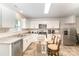 Modern kitchen featuring white cabinets, granite countertops, and stainless steel appliances at 152 Grassy Meadow Ln, Statesville, NC 28625