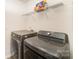 Laundry room with stainless steel washer and dryer, and wire shelving at 152 Grassy Meadow Ln, Statesville, NC 28625