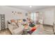 Inviting living room with neutral colors, wood-look flooring, and a comfortable sectional sofa at 152 Grassy Meadow Ln, Statesville, NC 28625
