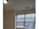 A bedroom window looks out onto a bright exterior at 15239 Wrights Crossing Dr, Charlotte, NC 28278