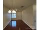 Open dining room features hardwood floors, neutral walls, and an elegant chandelier at 15239 Wrights Crossing Dr, Charlotte, NC 28278