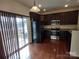 Well-equipped kitchen features stainless steel appliances, dark cabinetry, and a sliding door to the patio at 15239 Wrights Crossing Dr, Charlotte, NC 28278