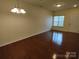 Bright and airy living room featuring hardwood floors, neutral walls, and plenty of natural light at 15239 Wrights Crossing Dr, Charlotte, NC 28278