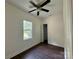 This bedroom has a large window and closet space, as well as vinyl flooring at 16 Cherry St, Albemarle, NC 28001