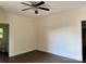 A bedroom with wood flooring, ceiling fan and view of en suite bathroom at 16 Cherry St, Albemarle, NC 28001